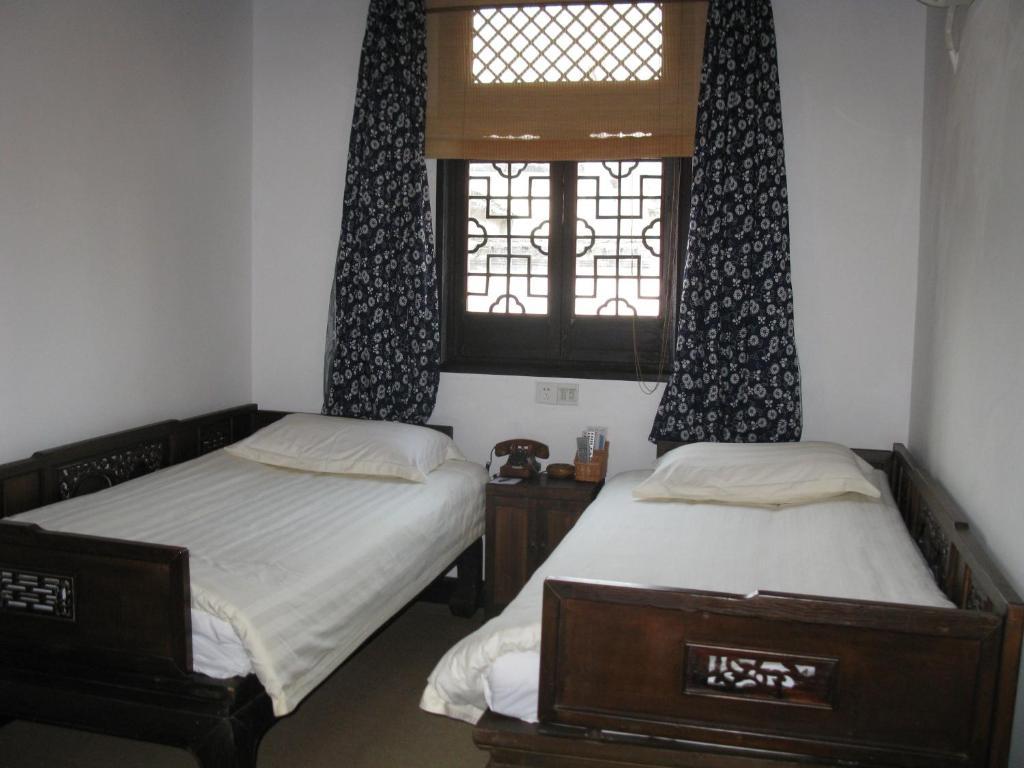 XI Di Travel Lodge Yi (Anhui) Rom bilde